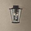 Jantzen Wall Sconce front view on beige wall, emphasizing the trapezoidal lantern shape