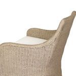 Partial side angle focusing on curved armrest and white cushion of Blaire chair