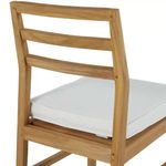 Back view showing horizontal slats and wood grain details of teak chair frame