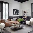 Side view in home setting with natural light showcasing armchair's sculpted wood arms and plush fur upholstery