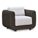 Soma chair shown at three-quarter angle highlighting curved arms and thick cushions