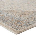 Close-up corner view showing texture and short cream fringe with detailed medallion border