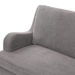 Close-up focusing on left armrest's rounded shape and fabric texture in Broadway Denim