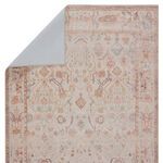 Corner folded back revealing light blue rug backing and underside color contrast