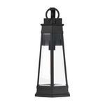 Matte black outdoor wall lantern with tapered rectangular shape and clear beveled glass panels
