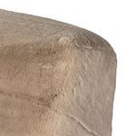High-detail close-up of dense shaggy chair upholstery with visible stitching folds