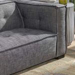 Close-up of Eli sofa corner showing fabric texture, seam details, and tufting on cushions