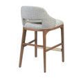 Rear angled view highlighting soft fabric curve and clean joinery of wooden legs