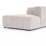 Close-up view of wide vertical channel stitching on sandstone performance fabric chaise section