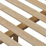 Detail of mattress support slats closely spaced in natural wood with subtle grain markings