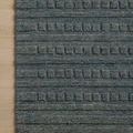 Top-down view of Bradley Teal Rug corner on wood floor highlighting detailed pattern