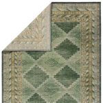 Corner flipped to reveal reverse side with lighter green and beige pattern variation