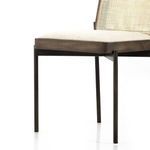 Four Vail Thames cream dining chairs paired with wood farmhouse table in cozy dining room