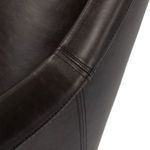 Detailed view of armrest stitching and smooth leather finish
