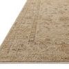 Close-up angled side view showing low pile height and detailed woven border of the Willa Wheat rug