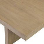 Close-up of polished oak veneer grain and rounded corner on Matthes Dining Table
