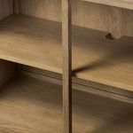 Interior shelving detail with wood grain finish and cable management cutouts