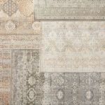Assortment of vintage style rugs with Hakeem oriental gray/gold layered on top