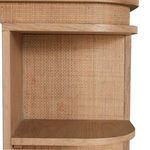 Close-up of curved side shelves with rattan back panel behind wood shelving