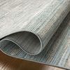 Rolled edge exposing rug’s underside and thin profile against wood floor