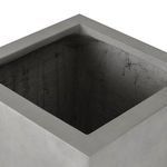Top-down view inside planter showing square opening and rough inner surface