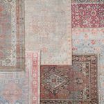 Multiple area rugs overlapped for color comparison including the Wesleyan Medallion rust and gray rug