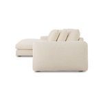 Side profile of Berga sectional revealing arm thickness and cushion height in soft fabric
