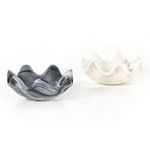 Two polished marble bowls side by side; one white lotus shape and one black marble variant