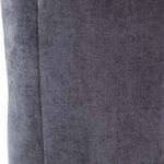 Close-up of charcoal velvet texture on the chair’s rear panel