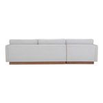 Back view of Vernon sectional showcasing fabric upholstery and wooden base plinth