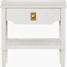 Front view of the white Doheny End Table highlighting the brass drawer knob and scalloped drawer edge