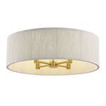 Underside view revealing warm brass base and four candelabra bulb sockets inside woven rope shade