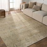 Rug placed next to a beige sofa and natural wood side table in a sunlit living room