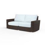 Montecito Loveseat with rich Cognac multi-colored resin wicker frame and white seat and back cushions