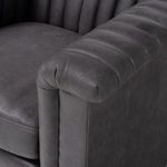 Close-up inside corner where backrest meets arm showing tight seam and channel detail