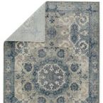 rug back showing weave and lighter blue-gray color with detailed corner folding