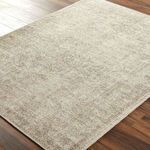 Close-up of Margot Dusty Sage rug displaying detailed texture and soft color variations on wood floor