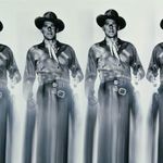 Zoomed detail of Ronald Reagan's face and belt with blurred motion effect in the black and white photo
