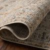 Close-up of Milena rug rolled to highlight texture and density of the power-loomed fibers