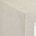 Close-up showing ivory terrazzo concrete texture with small neutral-colored flecks on Carson table