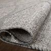 folded section displaying backside and thickness of flat weave polypropylene rug