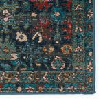 Detailed close-up focusing on edge binding and dense pile with floral motifs