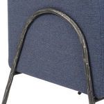 Close-up of textured aged black iron frame arching along side of Jacobsen Denim Barrel Chair