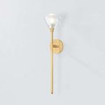 Angled view of wall sconce showing slight glow from lit bulb inside crystal shade against white wall