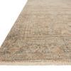 Close-up side angle of Priya Rug showing woven texture and fringe detail on light background