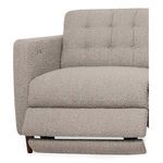 Close-up of sofa arm and seat cushion in beige textured bouclé fabric with tufting