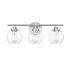 Front view showing symmetrical alignment of the three clear glass fishbowl shades on satin nickel fixture