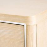 Close-up of top corner highlighting natural wood grain, rounded edges, and sleek metal trim