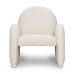 Front view of Nicola chair showcasing full front upholstery and curved armrests