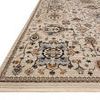 Angled side view of the Leigh Ivory Taupe rug highlighting woven texture and fringe detail on edge